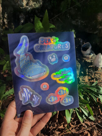 Planche de stickers sur le thème marin/ Prix (sans les frais de ports): 10€/ Finition: Brillant/ Effet: Holographique/ Dimension: 13x16,3cm